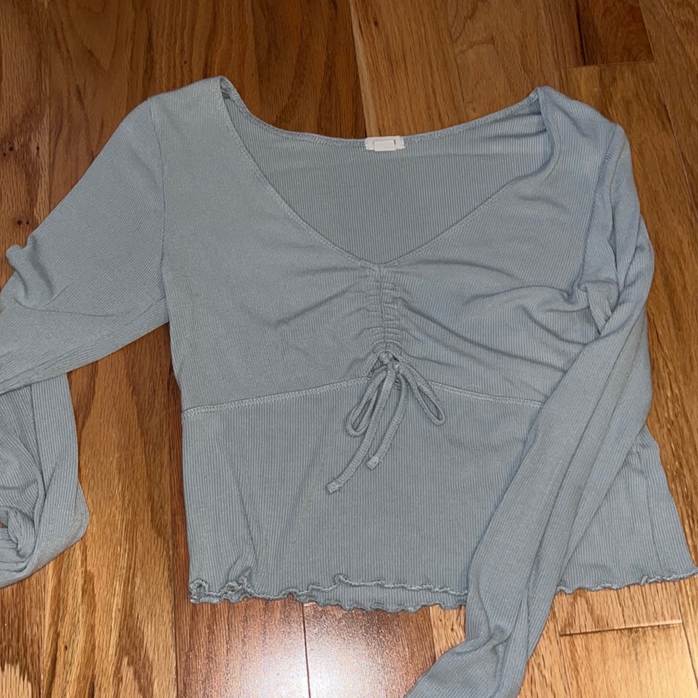 Light blue cropped top.